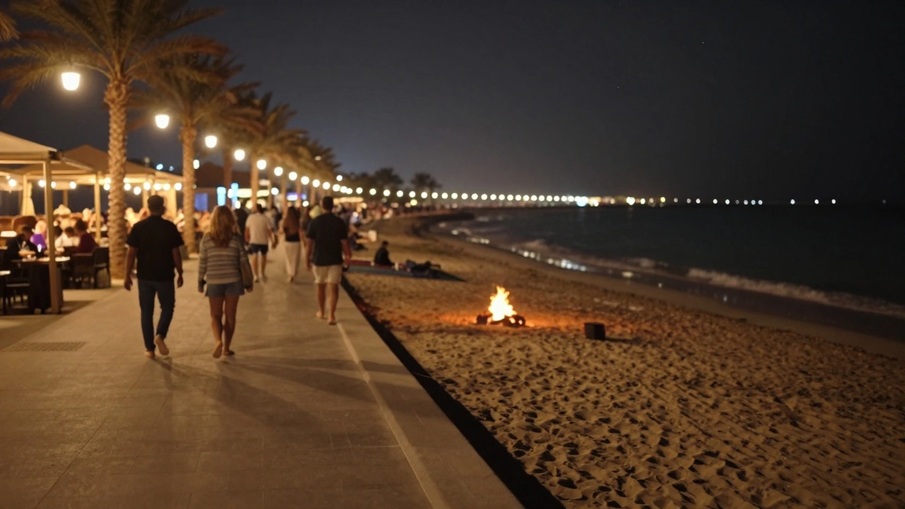Nighttime walk on JBR Beach with soft lights, bonfire, and calm waves.